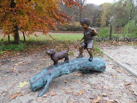Bronzen beeld kind met hond - GardenArts